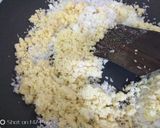 A picture of step 8 of Coconut Mawa balls immersed in Creamy Coconut saffron milk.