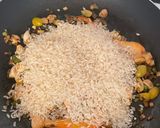 A picture of step 4 of Delicious Mixed Paella with Chicken, Shrimp, and Mushrooms.