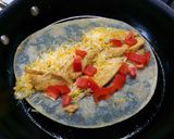 A picture of step 14 of Seasoned Chicken & cheese wrap with bell peppers and sour cream..