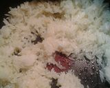 A picture of step 2 of Fried nuts and rice.