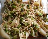 A picture of step 5 of Cheesy Chicken Alfredo stuffed shells.
