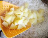 A picture of step 6 of Carrots and potatoe rice.