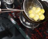 A picture of step 1 of Kashmiri Dum Aloo.