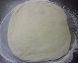 A picture of step 4 of American Pizza with Basil Pesto.
