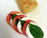 A picture of step 2 of Tomato Mozzrella with basil panini.