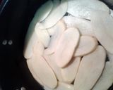 A picture of step 2 of layered potato hamburger casserole.