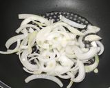 A picture of step 4 of Miso soup with tofu, daikon, onion.