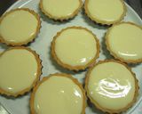 A picture of step 6 of Rich No-Bake Cheesecake Tarts.