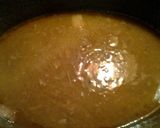 A picture of step 8 of Boston butt stuffed with shallots stove top.