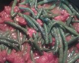 A picture of step 2 of Spicy green beans, tomatoes, and pecans.