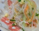 A picture of step 5 of Sunomono-Style Carrot, Cucumber, and Egg Salad.