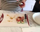 A picture of step 6 of Cucumber hummus boat.