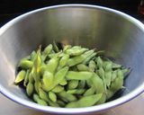 A picture of step 1 of Garlic Edamame - Great When Drinking.
