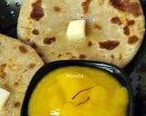 A picture of step 11 of Oats Paneer stuffed coin paratha with Aamras.