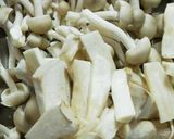 A picture of step 2 of Stir Fried Pork, Shimeji Mushrooms and King Oyster Mushrooms with Oyster Sauce.