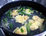 A picture of step 4 of Dumpling Noodle Soup.