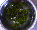 A picture of step 1 of Enoki and Wakame Miso Soup.