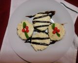 A picture of step 7 of No bake classic cheese cake with chocalate or christmas themed toppings.