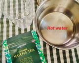 A picture of step 1 of MATCHA LATTE (Matcha green tea).