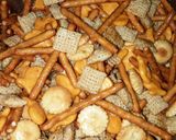 A picture of step 3 of Party "Chex" Crunchy Snack Mix.