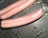 A picture of step 2 of Pan fried hotdog sandwich.