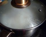 A picture of step 4 of Cooking Rice in a Pot Without it Boiling Over.
