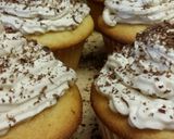 A picture of step 7 of Vanilla cake with coffee butter cream frosting.