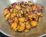 A picture of step 7 of Sem Aloo with Kalonji Seeds.