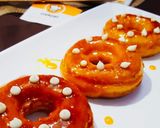 A picture of step 10 of Orange Glaze doughnut.