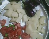 A picture of step 1 of Potatoes And brinjal egg plant veg.