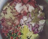 A picture of step 1 of Aalu Gosht.