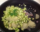 Foto del passaggio 12 della ricetta Ravioli con ripieno di gamberi, amaretti e patata, su crema di asparagi e fonduta di ricotta salata
