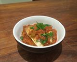 A picture of step 7 of Papad stuffed with paneer in tomato and onion gravy.