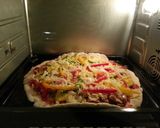 A picture of step 7 of Hawaiian Pizza..