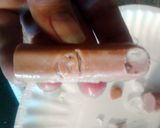 A picture of step 4 of Bloody Severed Fingers ( hot dogs with ketchup ) halloween.