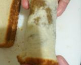A picture of step 9 of French Toast Banana Fosters Roll-Ups.