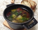 A picture of step 7 of Ajillo with Japanese Leek and Dried Tomatoes.