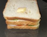 A picture of step 2 of 3 layered cheese sandwich.