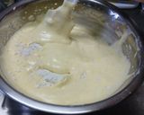 A picture of step 8 of Fluffy Madeleines with Orange Peels.