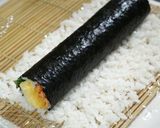 A picture of step 6 of California Roll using Grilled Salmon.