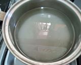 A picture of step 1 of Easy Sugar Syrup (Sheera).