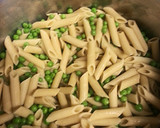A picture of step 5 of Chicken Penne Alfredo with veggies and homemade sauce.