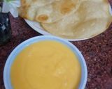 A picture of step 5 of Aam ka Ras/ Amrus with poriyan.
