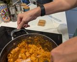 A picture of step 6 of Pasta alla vodka, with pork and sprouts.