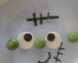 A picture of step 3 of Frankenstein Monster and a Skull Halloween Character Bento.