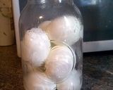 A picture of step 2 of Amish Yellow Pickled Eggs.