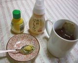 A picture of step 1 of Prevents Colds Honey Ginger Lemon Tea.