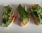 A picture of step 8 of Goat Cheese and Blood Sausage Toasts with Caramelized Onion.