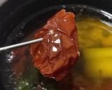 A picture of step 9 of Ajillo with Japanese Leek and Dried Tomatoes.