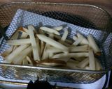 A picture of step 3 of Home made cheese fries.